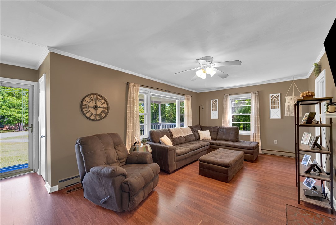 301 Clinkscales Street Iva, SC 29655 - Photo 3 of 36 This inviting living area features warm wood flooring and abundant natural light.