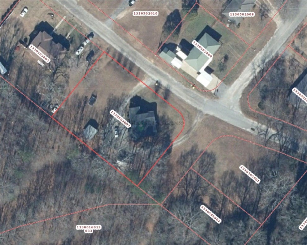 301 Clinkscales Street Iva, SC 29655 - Photo 34 of 36 Explore the expansive land with established trees and accessible roadways, offering a prime development opportunity.