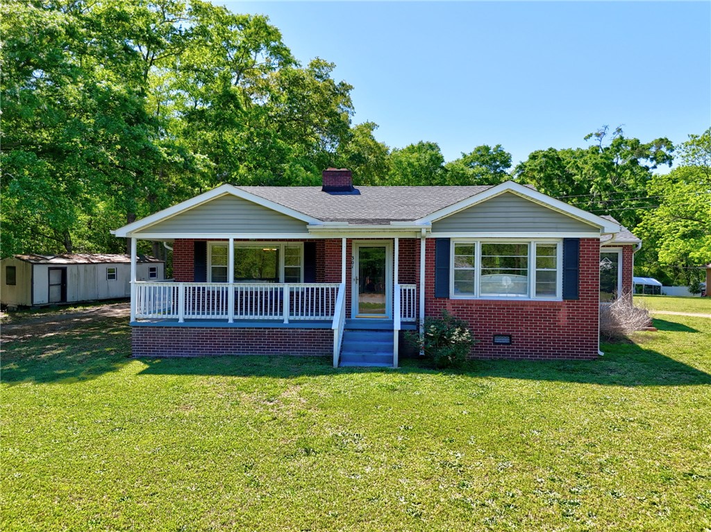 301 Clinkscales Street Iva, SC 29655 - Photo 35 of 36 This charming residence features a classic brick exterior and a welcoming front porch.