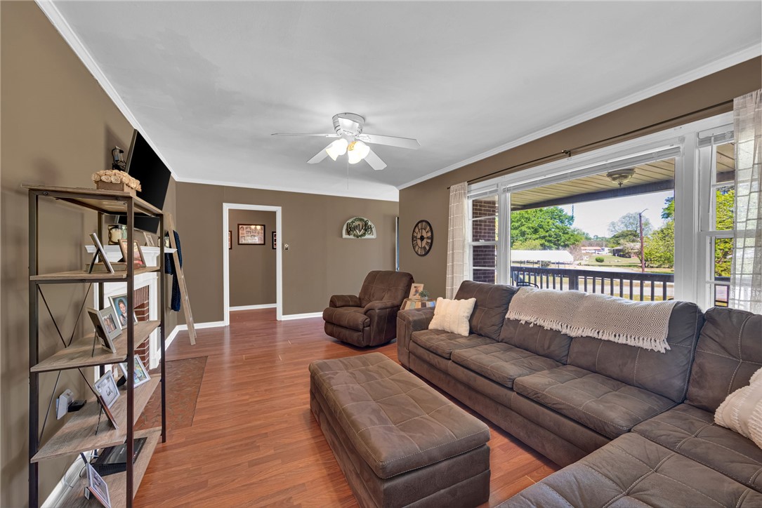 301 Clinkscales Street Iva, SC 29655 - Photo 4 of 36 This inviting living room offers wood-style flooring and abundant natural light.