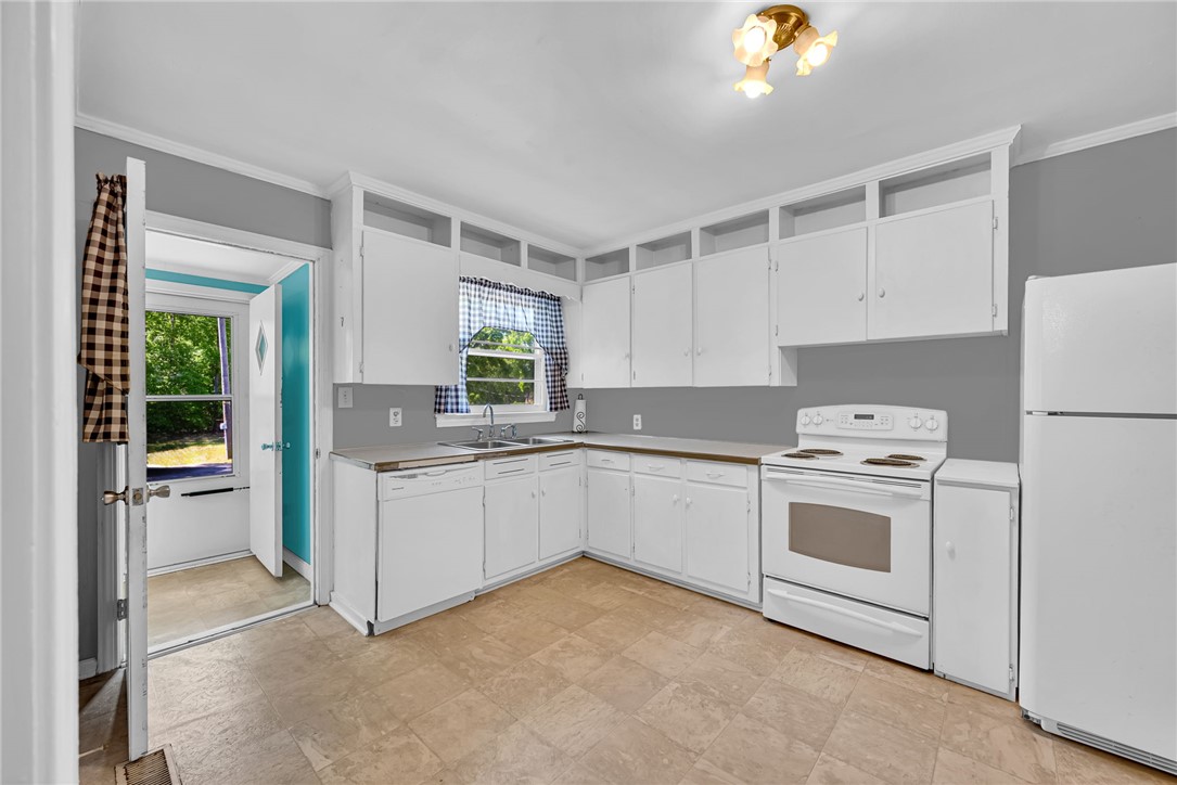 301 Clinkscales Street Iva, SC 29655 - Photo 10 of 36 This spacious kitchen offers a functional layout with ample cabinet space.