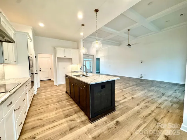 a kitchen with wooden cabinets and a sink