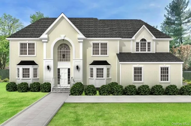 a front view of a house with a yard