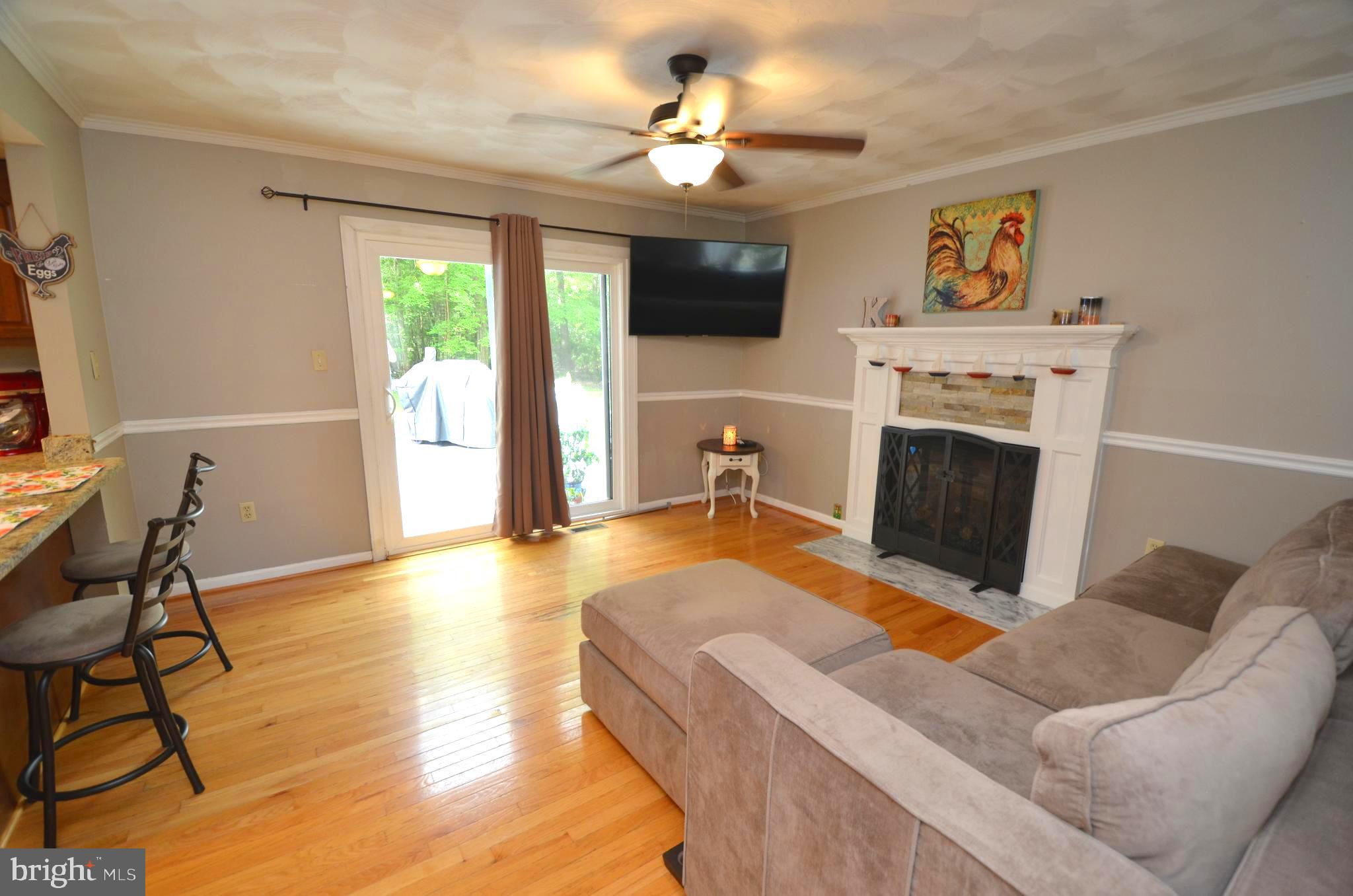 1527 Snug Harbor Road Shady Side, MD 20764 - Photo 8 of 39 Family room with gas fireplace