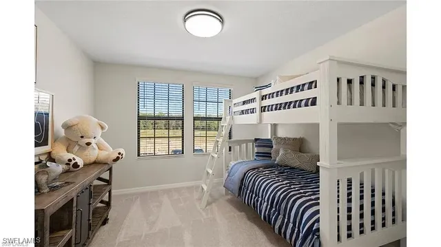 a bedroom with furniture and a window