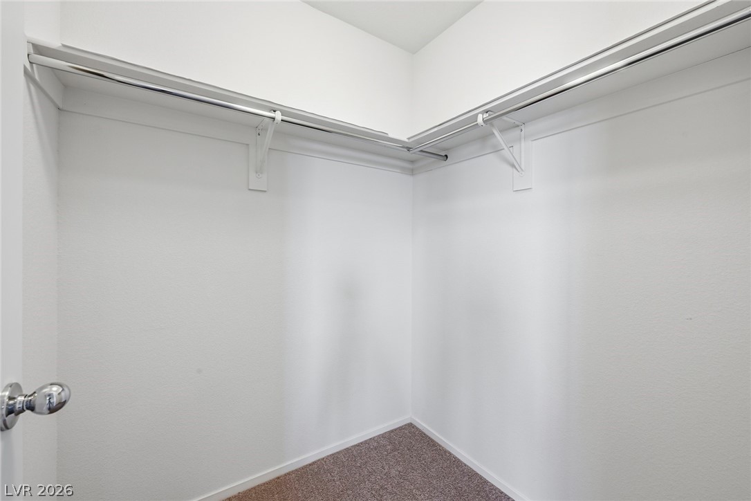 250 Dedication Avenue Henderson, NV 89011 - Photo 39 of 67 Walk in closet with dark carpet