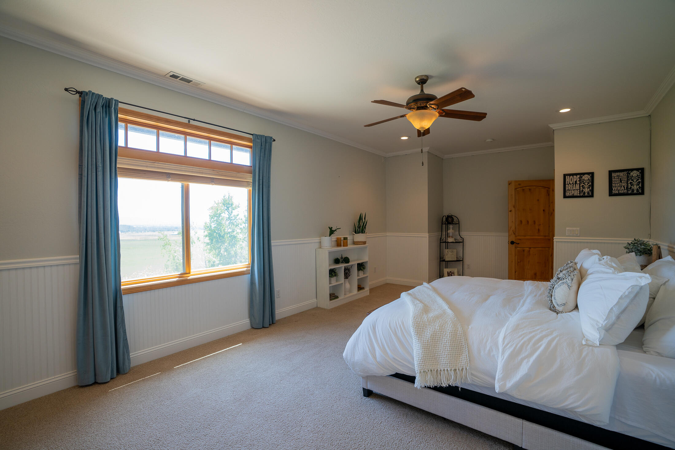 1881 Brophy Road Eagle Point, OR 97524 - Photo 77 of 130 a bedroom with a bed and a chandelier