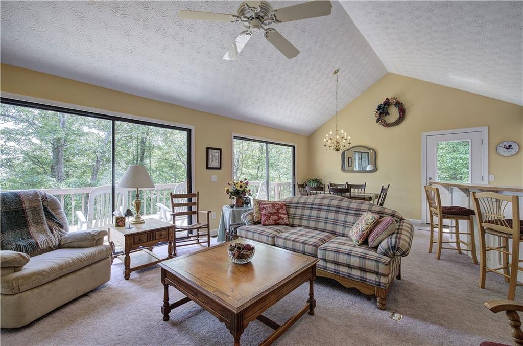 1379 Little Hendricks Mountain Road Jasper, GA 30143 - Photo 5 of 56 a living room with furniture and a large window