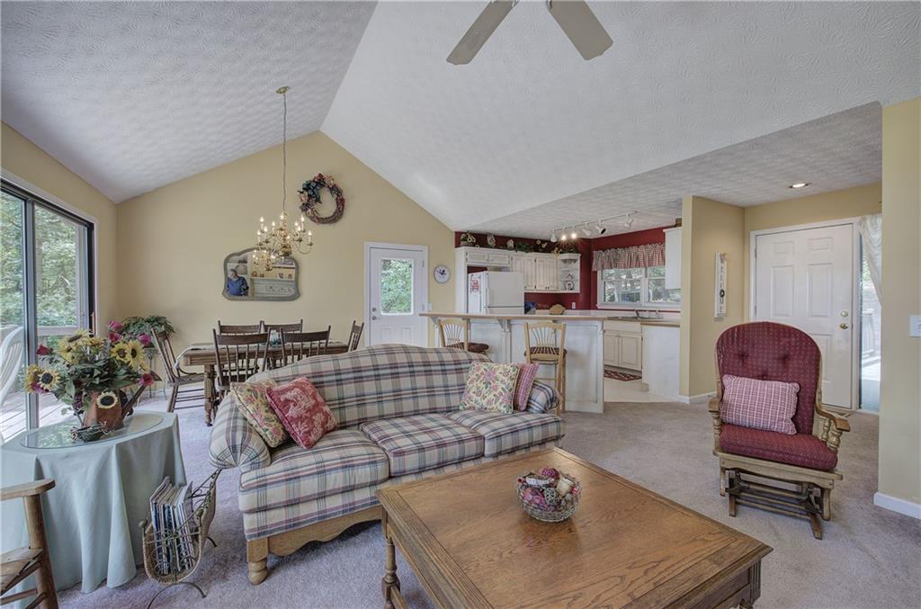 1379 Little Hendricks Mountain Road Jasper, GA 30143 - Photo 6 of 56 a living room with furniture and a large window