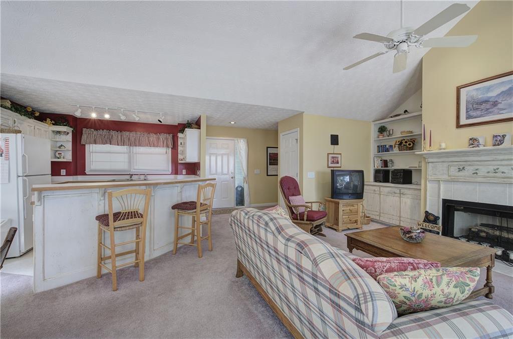 1379 Little Hendricks Mountain Road Jasper, GA 30143 - Photo 8 of 56 a living room with furniture and a fireplace