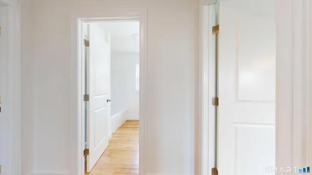 a view of a bathroom from a hallway