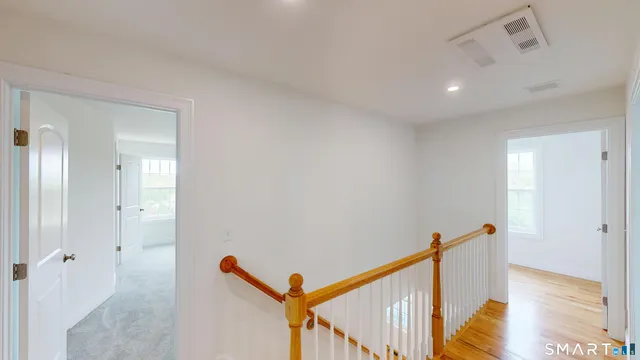 a view of a hallway with windows