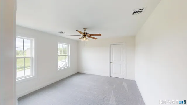 a view of empty room with windows