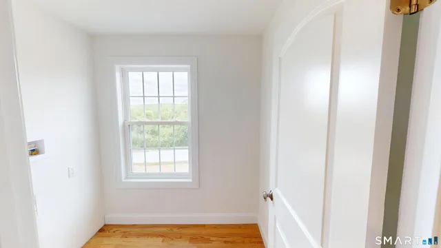 a view of a bathroom with a bathtub and window