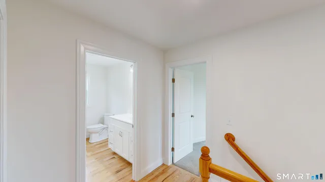 a bathroom with a toilet and a sink