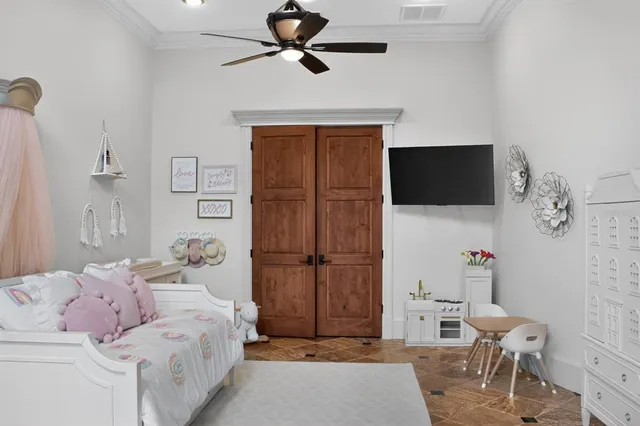 a view of a white building among the street with palm trees
