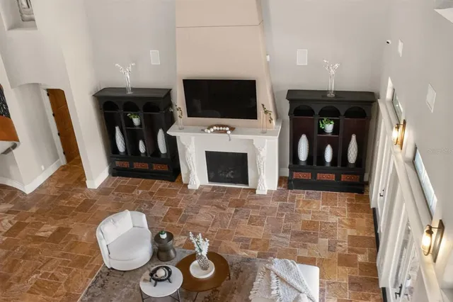 a view of a workspace with furniture and a flat screen tv