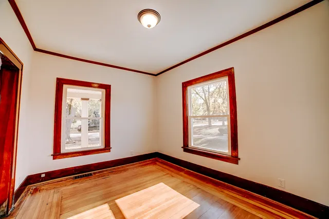 a view of a room with window and hallway