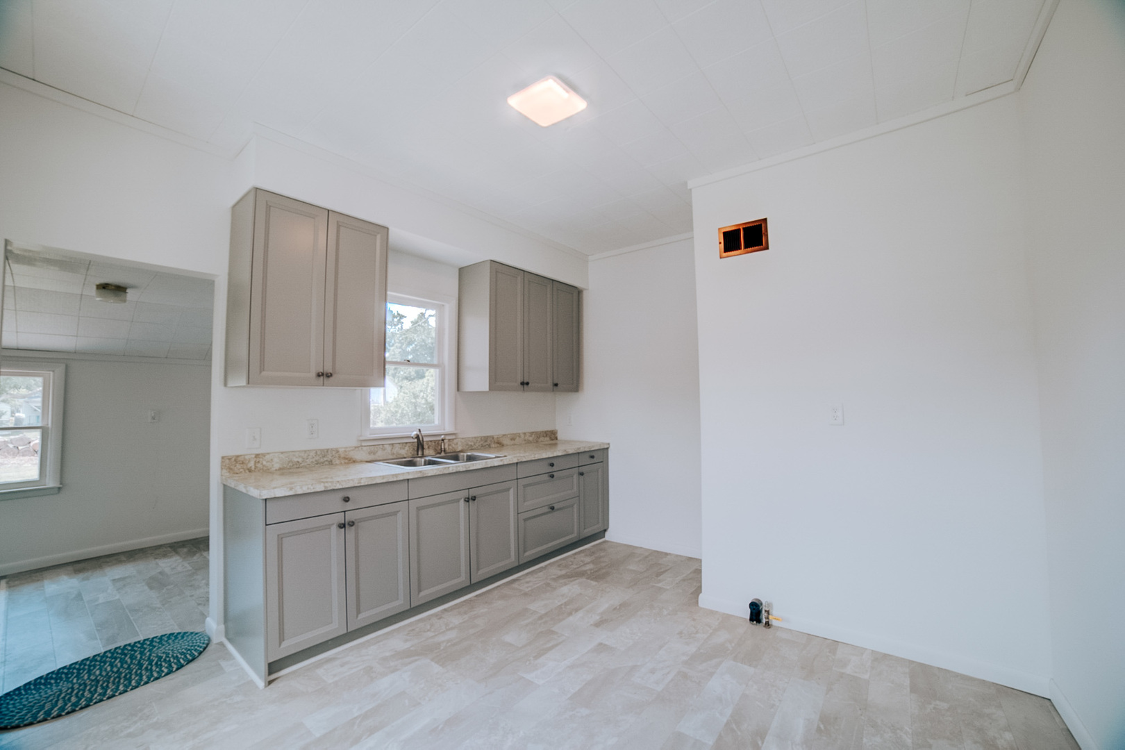 618 South Thomas Street Gilman, IL 60938 - Photo 19 of 38 a kitchen with a sink and cabinets
