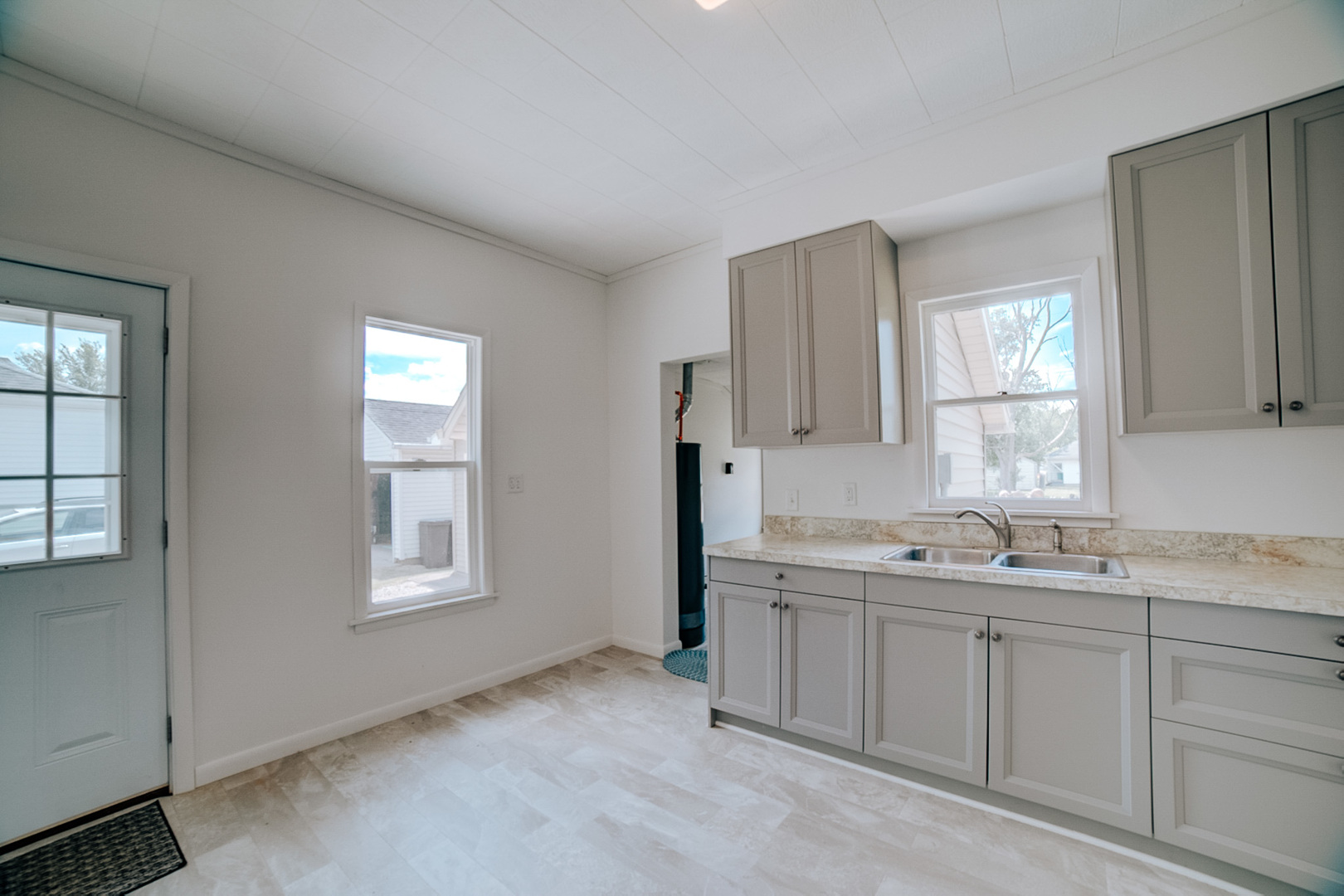 618 South Thomas Street Gilman, IL 60938 - Photo 20 of 38 a kitchen with a sink cabinets and window