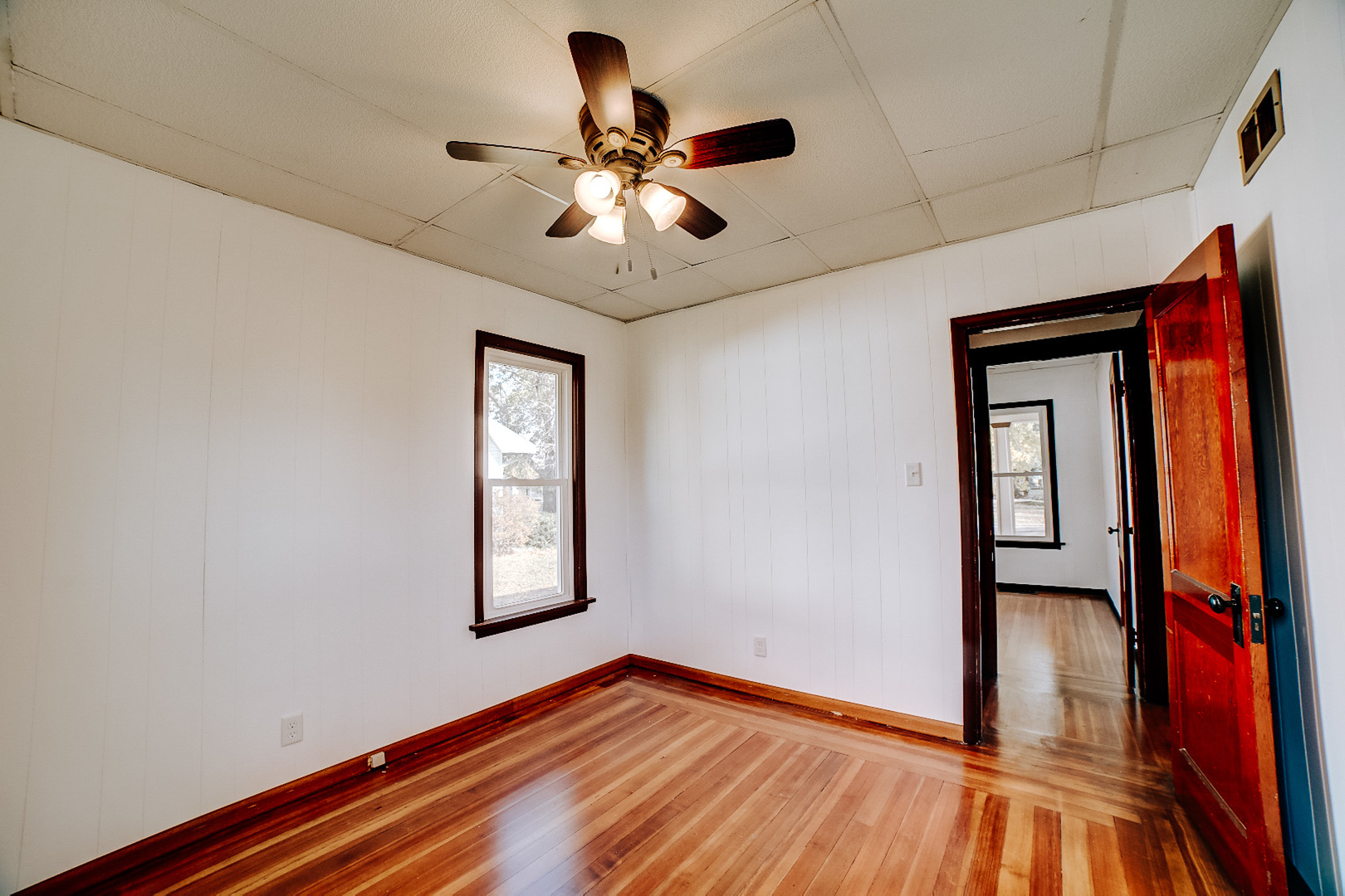 618 South Thomas Street Gilman, IL 60938 - Photo 24 of 38 a view of empty room with wooden floor and fan