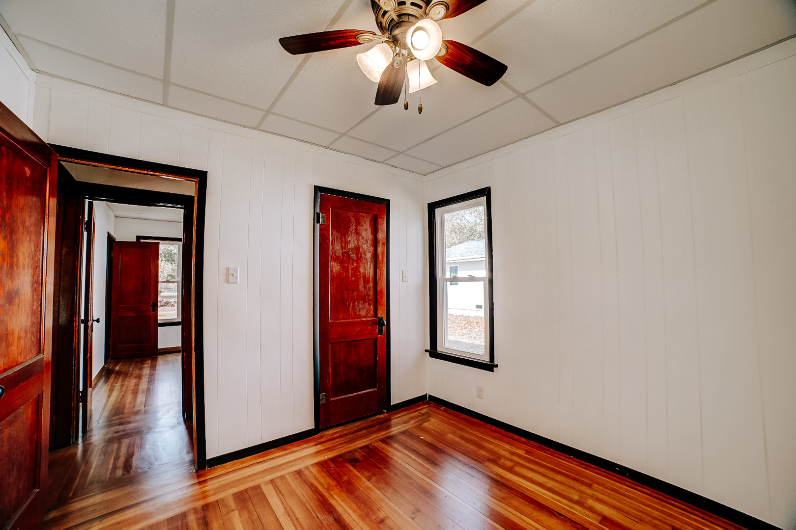 618 South Thomas Street Gilman, IL 60938 - Photo 33 of 38 a view of empty room with wooden floor and fan