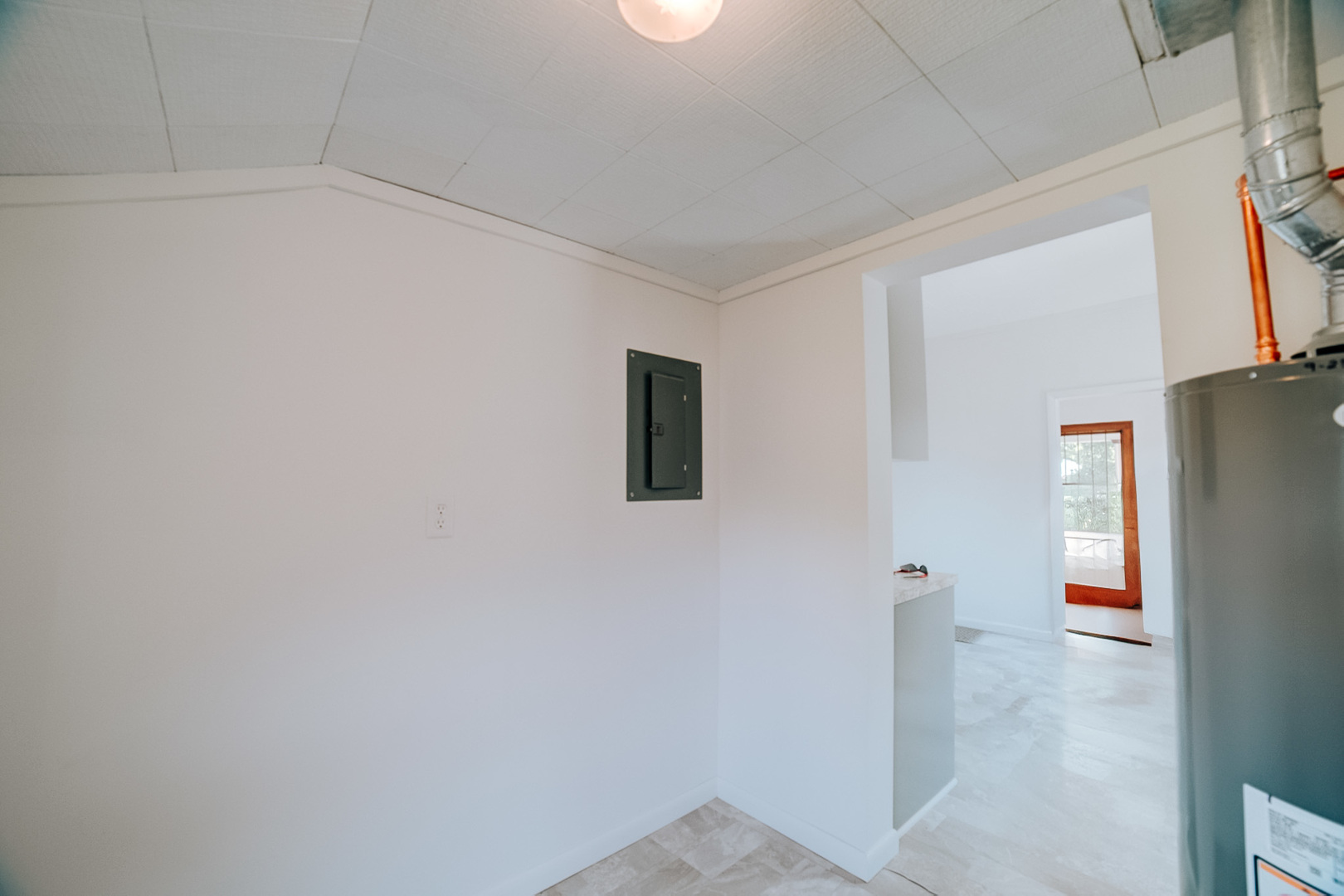 618 South Thomas Street Gilman, IL 60938 - Photo 36 of 38 a view of a livingroom with an empty space and a refrigerator