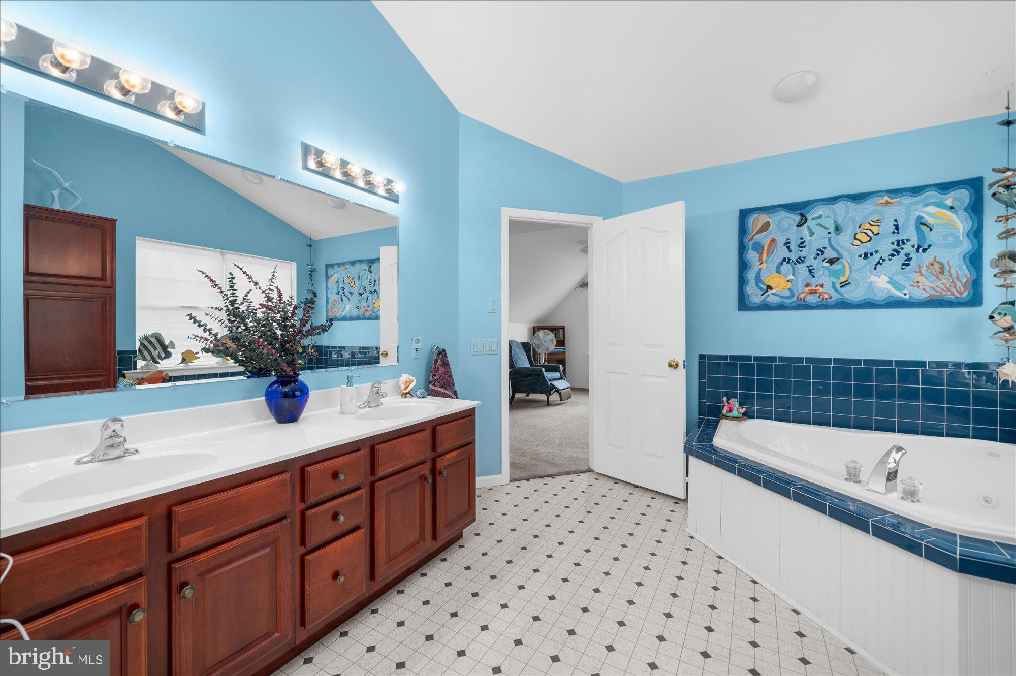 861 Dunkels Church Road Kutztown, PA 19530 - Photo 35 of 55 a bathroom with a tub a sink and a large mirror