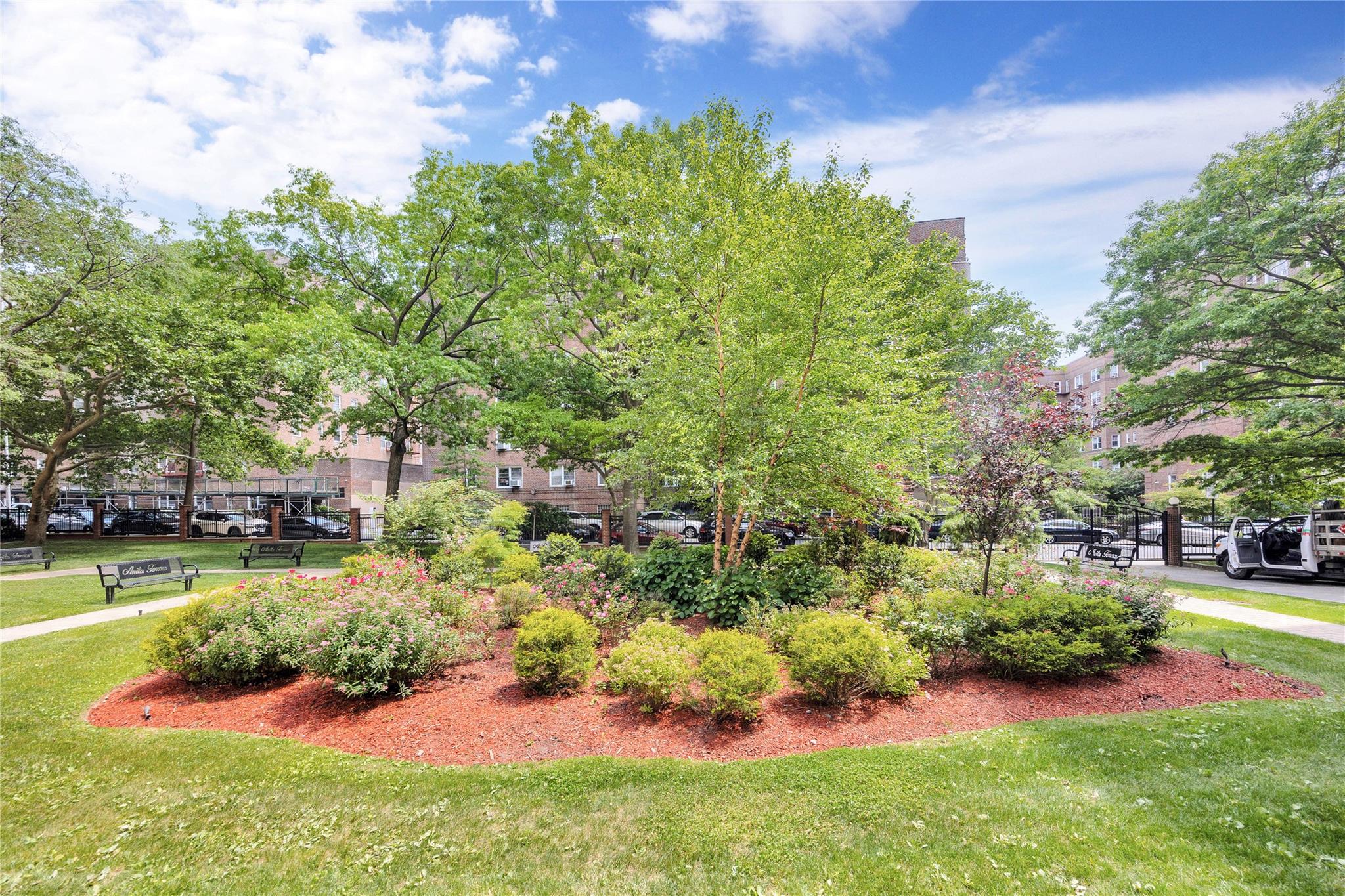 99-40 63rd Road, Unit 9Z Queens, NY 11374 - Photo 3 of 21 View of property's community featuring a lawn