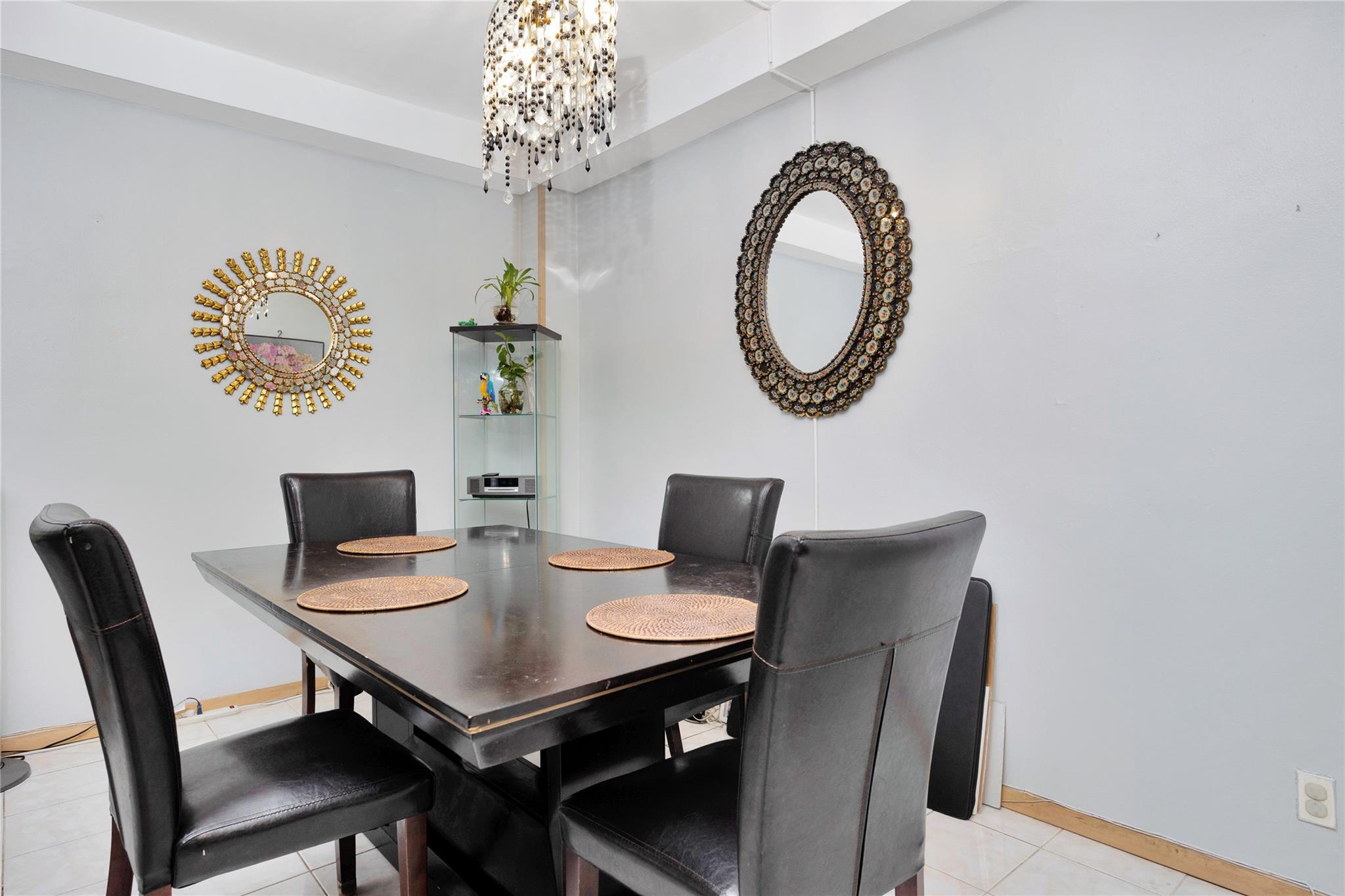 99-40 63rd Road, Unit 9Z Queens, NY 11374 - Photo 10 of 21 Dining room with a chandelier, light tile patterned flooring, and baseboards