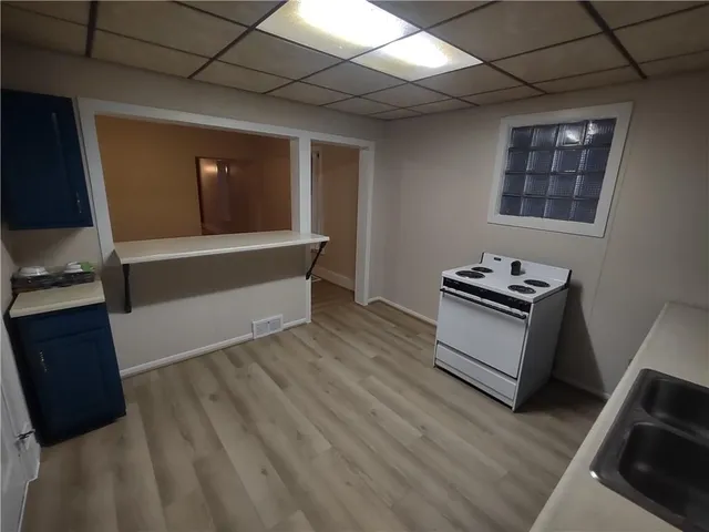 a view of kitchen with microwave and window