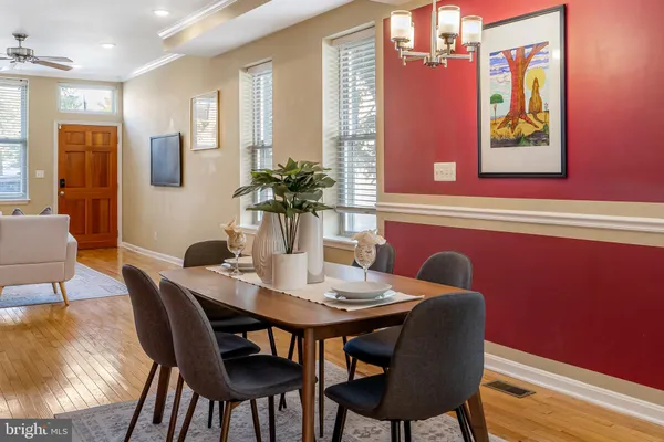 a view of a dining room with furniture window and wooden floor