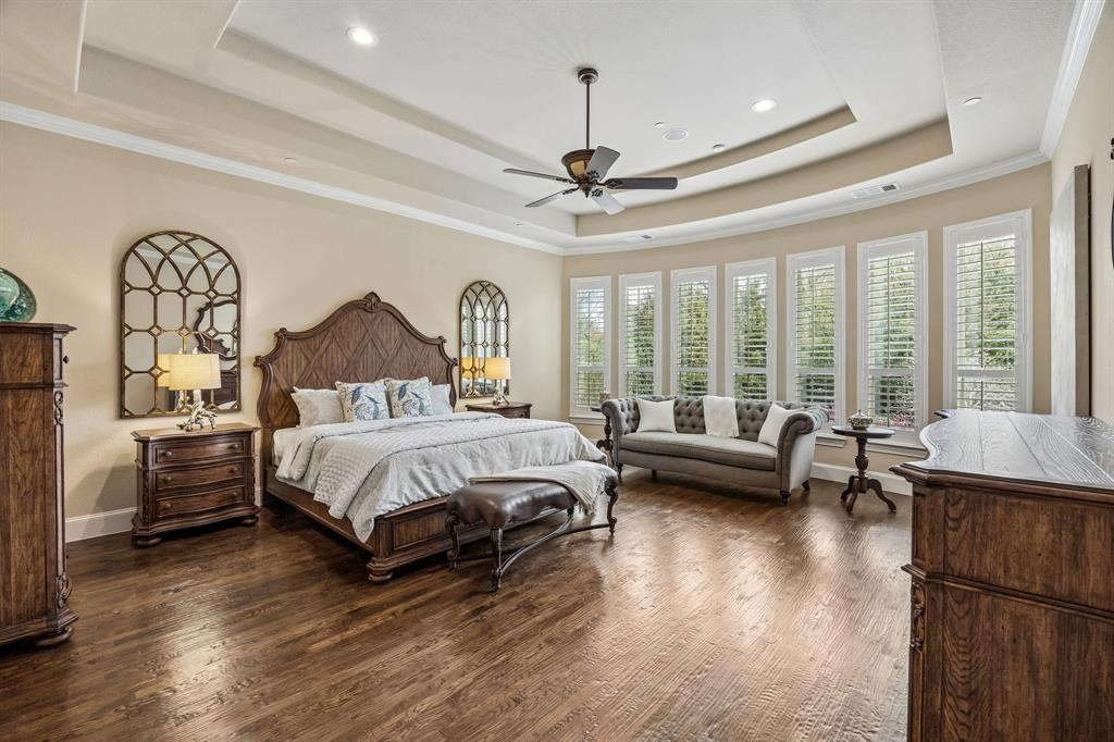 1005 Berkshire Road Southlake, TX 76092 - Photo 23 of 40 a spacious bedroom with a bed couch and a window