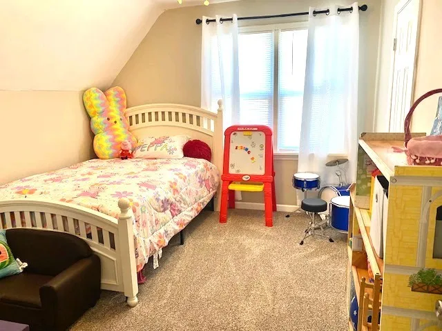 a bathroom with a granite countertop toilet sink and mirror
