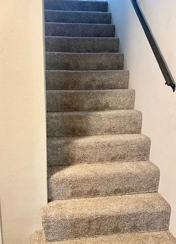 a bathroom with a toilet a sink and a window