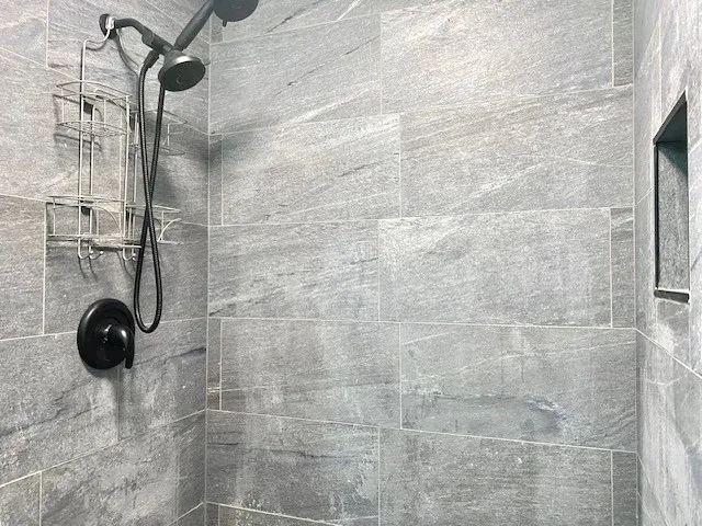 a bathroom with a glass shower door