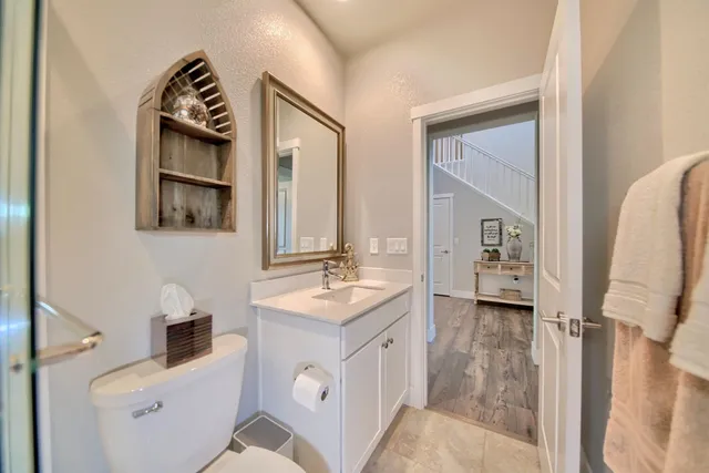 a spacious bathroom with a double vanity sink shower and a mirror
