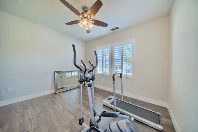 a view of walk in closet with clothes