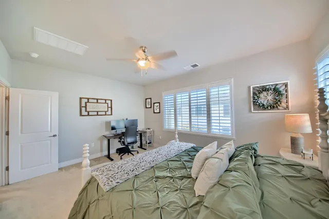 a view of a house with swimming pool and sitting area