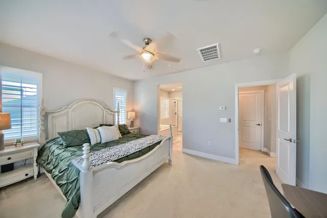 a view of a backyard with plants and patio