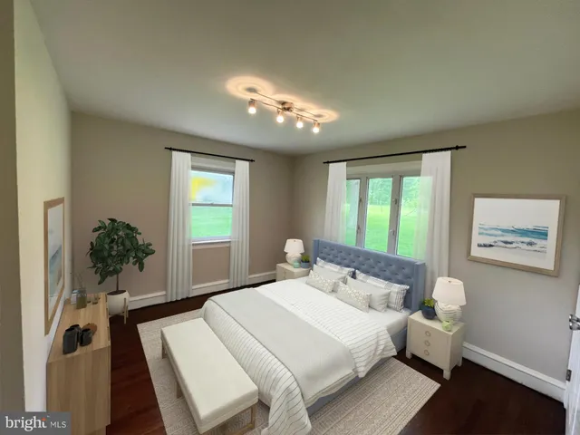 a bedroom with a large bed and a window