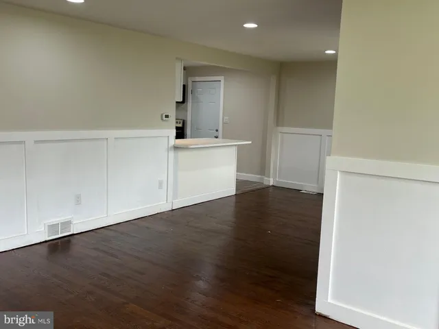 a view of a kitchen with wooden floor