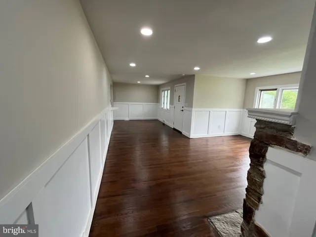 a view of a hallway with chairs
