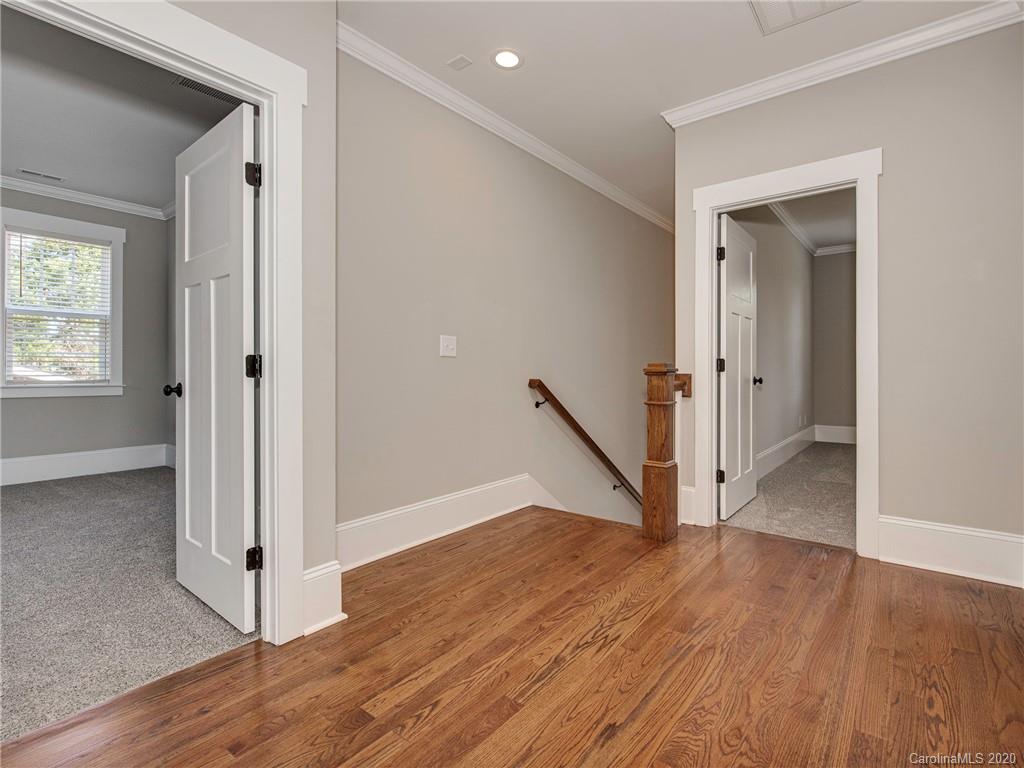 1808 Berryhill Road Charlotte, NC 28208 - Photo 18 of 34 a view of a hallway with wooden floor and entryway