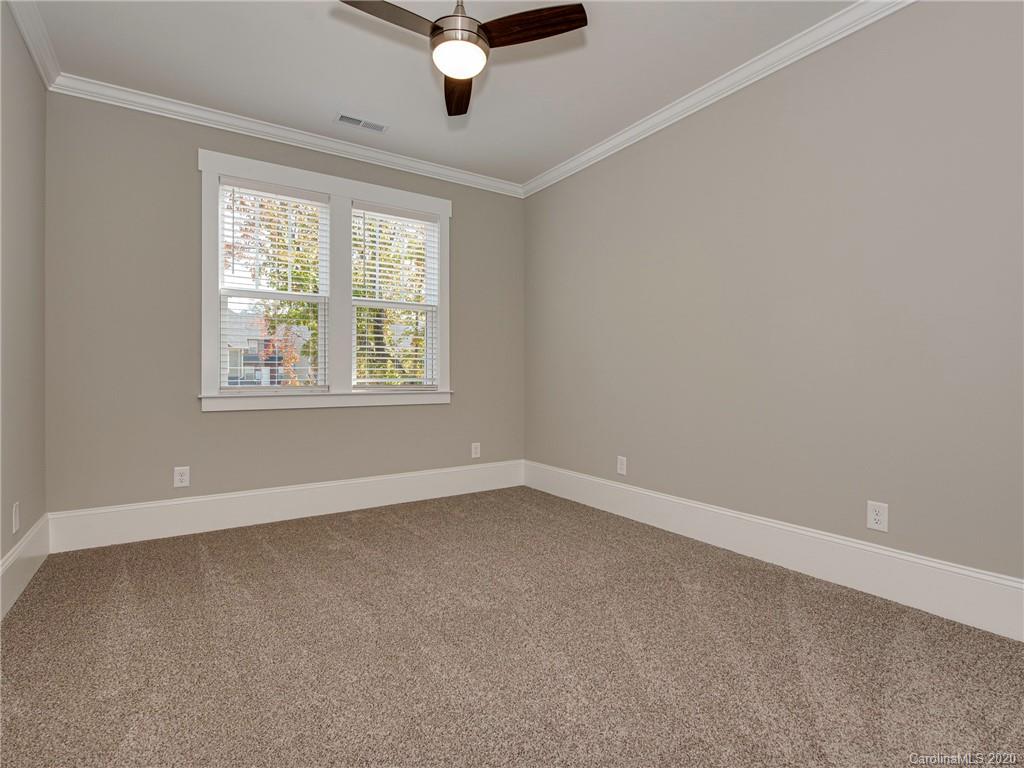 1808 Berryhill Road Charlotte, NC 28208 - Photo 22 of 34 an empty room with a window