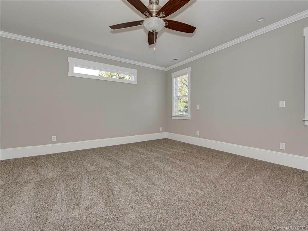 1808 Berryhill Road Charlotte, NC 28208 - Photo 23 of 34 a view of an empty room with a window