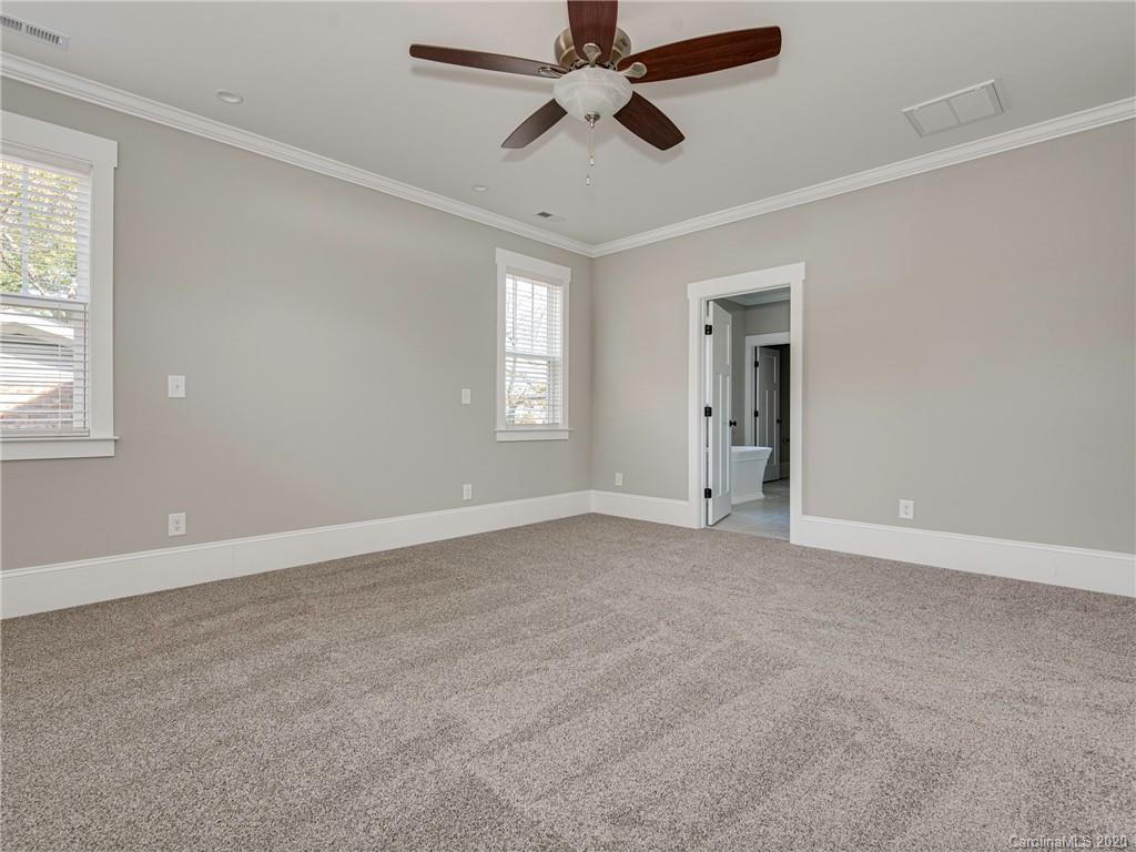 1808 Berryhill Road Charlotte, NC 28208 - Photo 24 of 34 a view of an empty room with a window