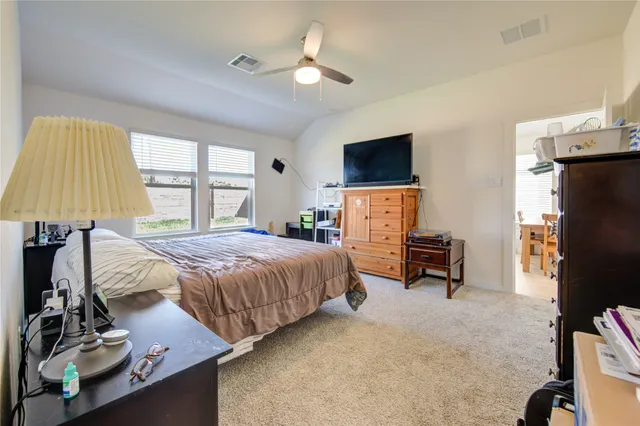 a view of a livingroom with furniture and a porch
