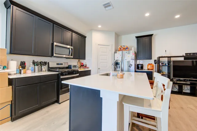 a view of a dining room with furniture and window