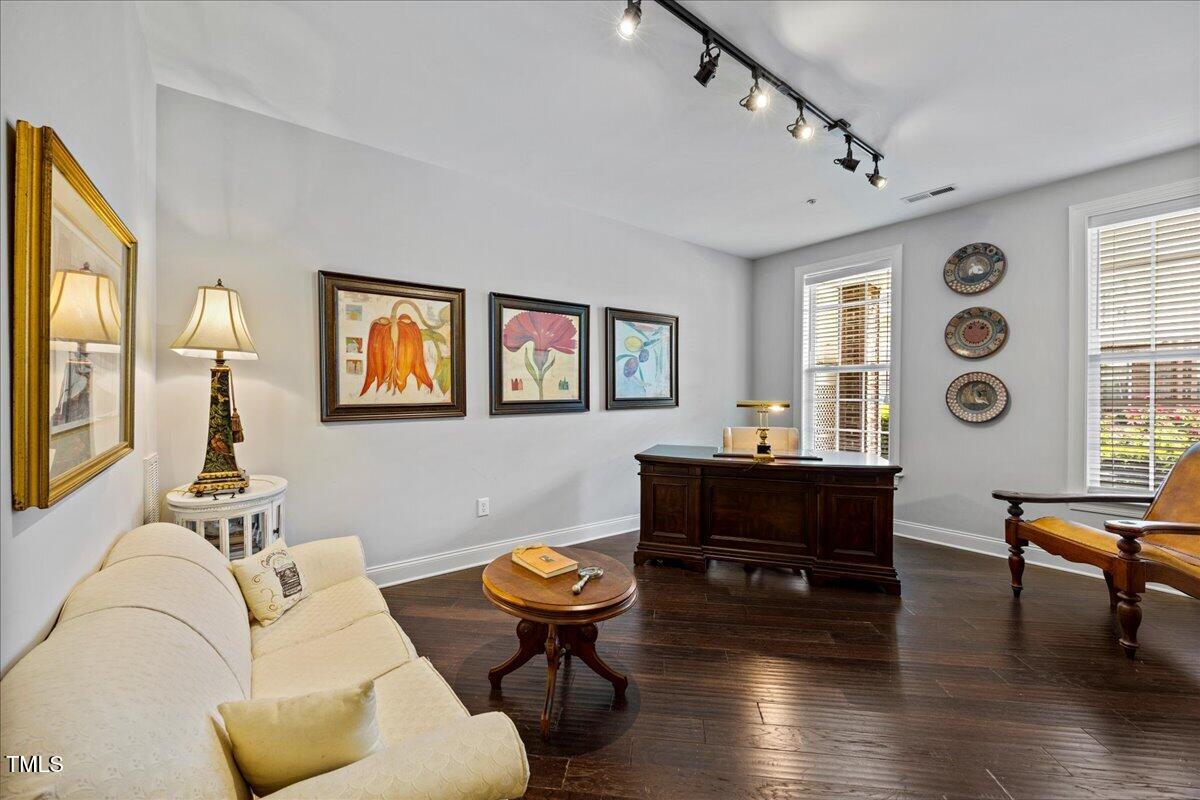 10520 Sablewood Drive, Unit 103 Raleigh, NC 27617 - Photo 17 of 38 a living room with furniture and a large window